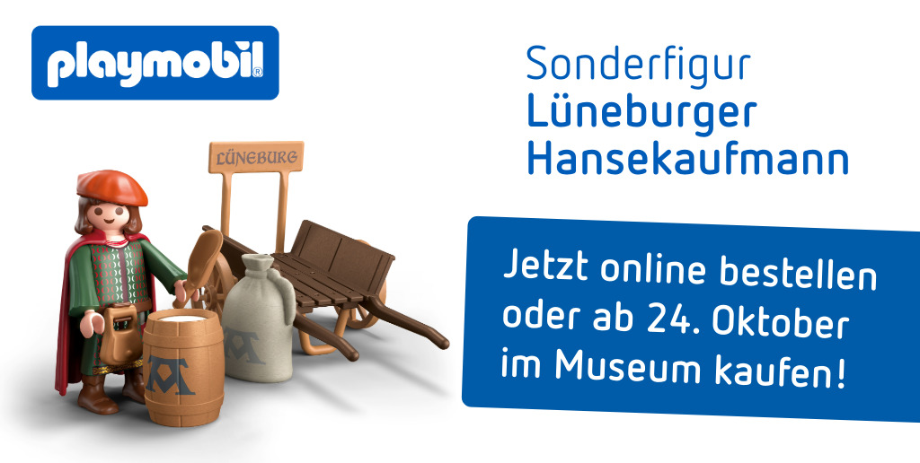 Leseabend mit Imre Grimm im Museum Lueneburg - Autor vor Büchern