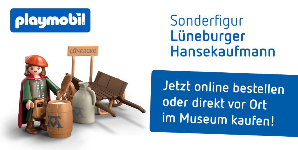 Leseabend mit Imre Grimm im Museum Lueneburg - Autor vor Büchern